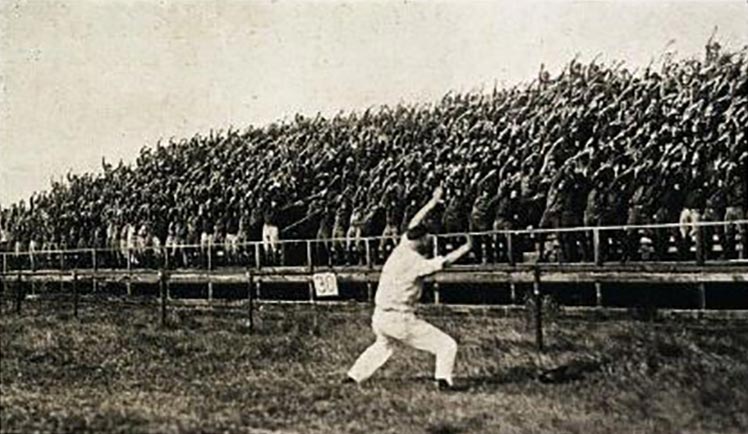 A Yell Leader leading yells in 1920