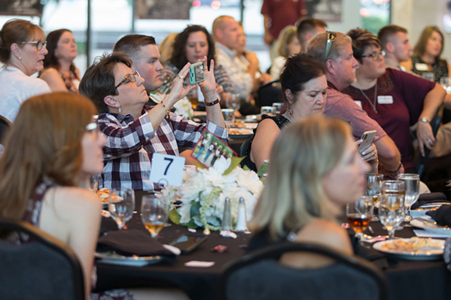 Club members enjoying a montly A&M Club lunch event