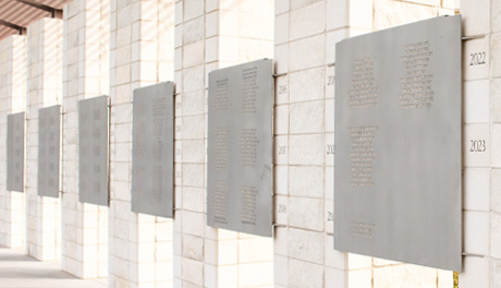 Names of past honorees etched in stone at the DA Tribute in Aggie Park